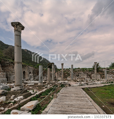 Ancient Roman ruins of Ephesus, with a Corinthian column and arched stone walls, Selcuk, Turkey Ancient Roman ruins of Ephesus, with a Corinthian column and arched stone walls, Selcuk, Turkey 131337373