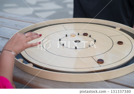 Strategic Game Pieces on a Wooden Board crokinole. Strategic Game Pieces on a Wooden Board crokinole. 131337380