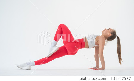 Caucasian woman doing sports exercises on white background. Caucasian woman doing sports exercises on white background. 131337577