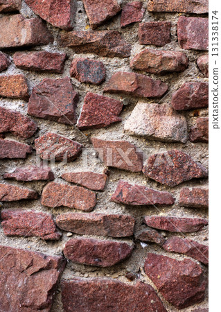 Closeup of a beautifully built stone wall made of red rocks Closeup of a beautifully built stone wall made of red rocks 131338174