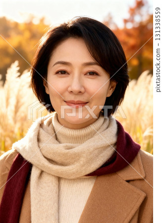 Middle-aged woman Autumn leaves and smiling female portrait 131338559