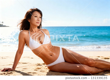 Portrait of a middle-aged woman in a swimsuit relaxing on the beach 131339135