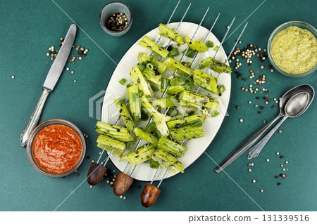 Vegetable celery skewers arrayed on a platter. 131339516