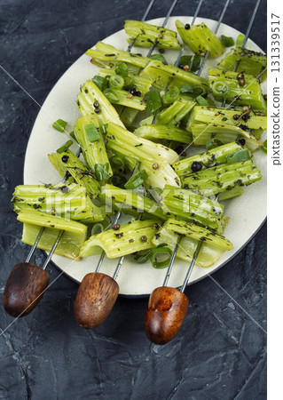Vegetable celery skewers arrayed on a platter. 131339517