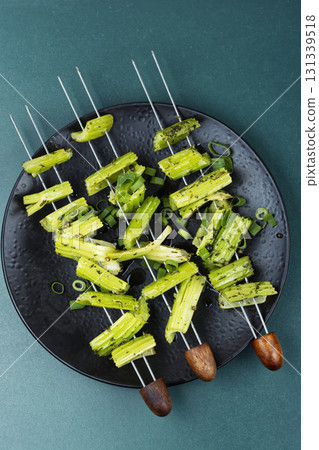 Vegetable celery skewers arrayed on a platter. 131339518