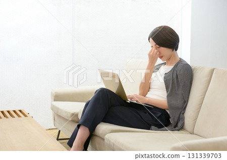 A woman who feels unwell due to work stress A woman who feels unwell due to work stress 131339703