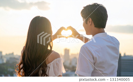 A couple making hearts by hand 131340005