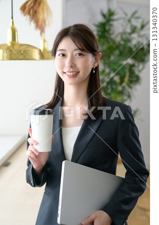 A woman working in a cafe 131340370