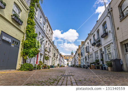 Quiet London mews with cobblestone lane and white townhouses Quiet London mews with cobblestone lane and white townhouses 131340559