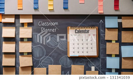 Classroom planner with calendar and sticky notes on blackboard in educational space Classroom planner with calendar and sticky notes on blackboard in educational space 131341039