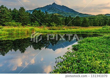 Sunset view of Rishiri Island's Menushoro Swamp and mountain silhouette Sunset view of Rishiri Island's Menushoro Swamp and mountain silhouette 131341070