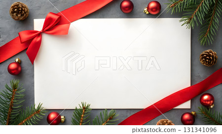 Festive holiday arrangement with red decorations and blank card for seasonal messages 131341096