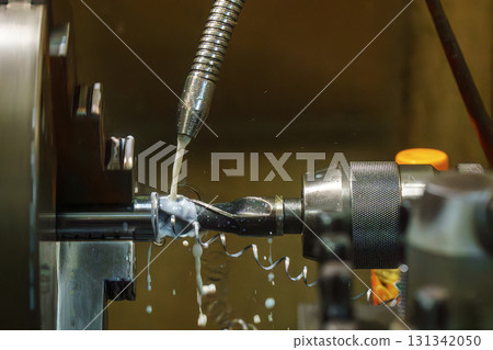 The hole drilling process on turning machine with liquid coolant method. 131342050