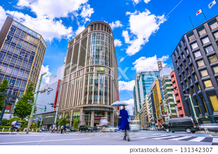Tokyo cityscape, Japan, September 24th. View of Nihonbashi Mitsukoshi in front of Mitsukoshimae Station and the intersection at the north end of Nihonbashi. Tokyo cityscape, Japan, September 24th. View of Nihonbashi Mitsukoshi in front of Mitsukoshimae Station and the intersection at the north end of Nihonbashi. 131342307