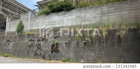 Japanese residential landscape with two-tiered retaining walls Japanese residential landscape with two-tiered retaining walls 131342485