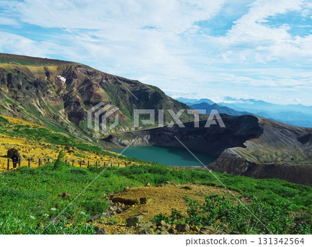 View of tourists heading to the Okama Observation Route from Zao Okama Observation Deck in summer 131342564