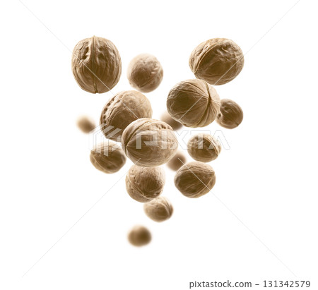 Whole walnuts levitate on a white background 131342579