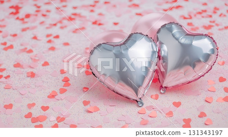 Silver and pink metallic heart shaped balloons lie on a glittery pink surface covered with small paper hearts, creating a festive scene for valentine's day, anniversaries, or romantic celebrations Silver and pink metallic heart shaped balloons lie on a glittery pink surface covered with small paper hearts, creating a festive scene for valentine's day, anniversaries, or romantic celebrations 131343197