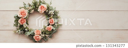 Delicate pink roses and eucalyptus leaves create a beautiful wreath on a white wooden background, perfect for valentine's day, mother's day, or spring celebrations Delicate pink roses and eucalyptus leaves create a beautiful wreath on a white wooden background, perfect for valentine's day, mother's day, or spring celebrations 131343277