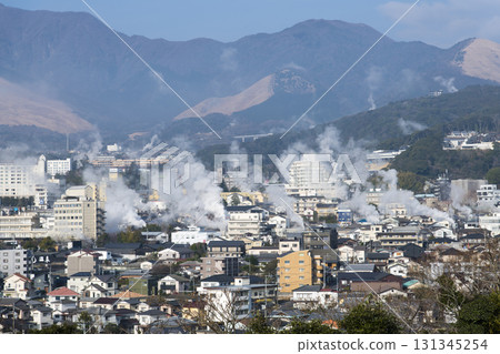 Beppu Onsen seen from high ground, with steam rising from the hot springs Beppu Onsen seen from high ground, with steam rising from the hot springs 131345254