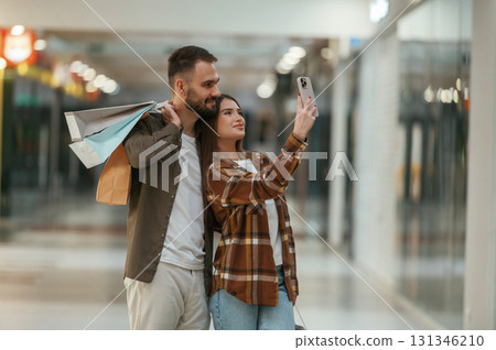 Making selfie. Young couple are in supermarket together 131346210