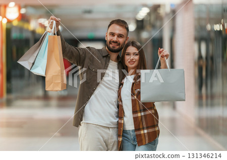 Shopping is finished. Young couple are in supermarket together Shopping is finished. Young couple are in supermarket together 131346214