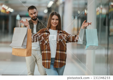 Guy is disappointed, mad. Young couple are in supermarket together 131346233