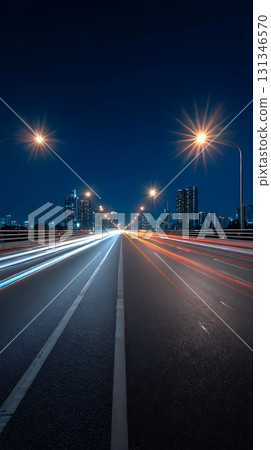 Night Cityscape View from Bridge with Car Light Streaks and Streetlamps 131346570