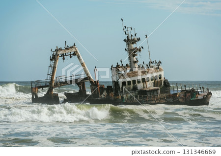 View of abandoned old drowned ship in the sea of Africa 131346669