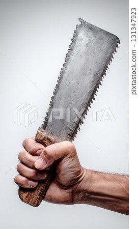 Hand Holding Rusty Vintage Bone Saw with Wooden Handle CloseUp Hand Holding Rusty Vintage Bone Saw with Wooden Handle CloseUp 131347923
