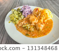 Chicken goulash with potatoes and salad. 131348468