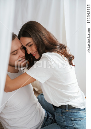 Lovely hug, embracing. Young couple are together at home 131348515