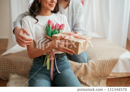 Conception of Valentine's day, embracing. Young couple are together at home 131348578