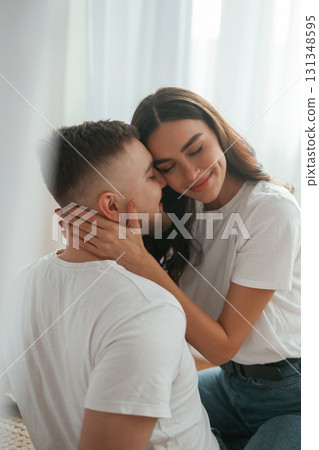 Lovely hug, embracing. Young couple are together at home Lovely hug, embracing. Young couple are together at home 131348595
