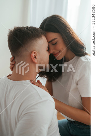 Lovely hug, embracing. Young couple are together at home Lovely hug, embracing. Young couple are together at home 131348596