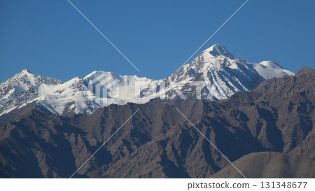 Snow covered peaks of the Zanskar Range, seen from Leh, India. 131348677