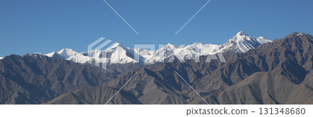 Snow capped high mountains seen from Leh, India. 131348680