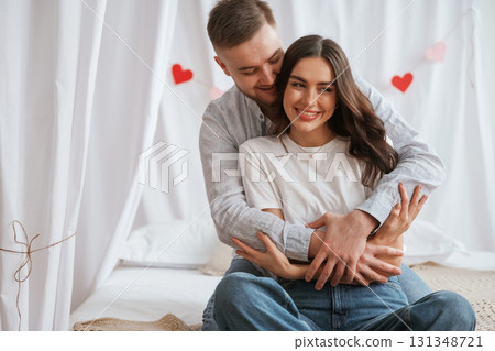 Festive decorations, Valentine's day. Young couple are together at home 131348721