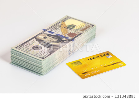 Stack of cash and yellow credit card on white background showing financial concept and confident mood 131348895