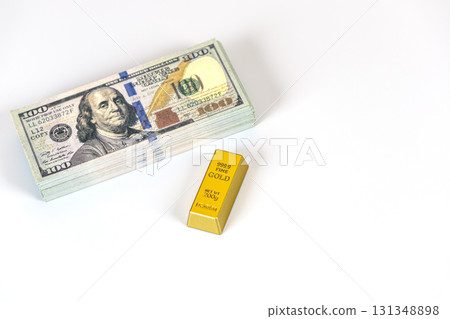 Stack of banknote and gold bar on white background conveying wealth and investment concept, bright lighting and clean composition with reflective metal and paper texture Stack of banknote and gold bar on white background conveying wealth and investment concept, bright lighting and clean composition with reflective metal and paper texture 131348898
