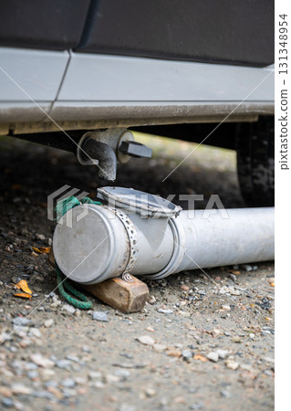 Camper van grey water drainage pipe system close up outdoors Camper van grey water drainage pipe system close up outdoors 131348954