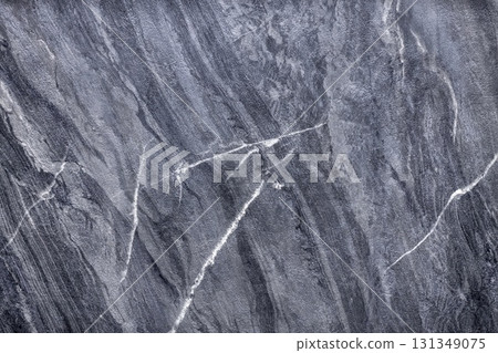 Elegant gray stone surface with intricate lines showcasing natural beauty and texture 131349075