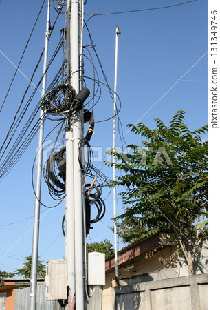 Urban Utility Pole with Tangled Communication Wiring Urban Utility Pole with Tangled Communication Wiring 131349746