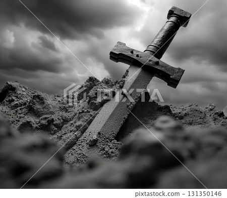 A sword is laying on the ground in a field 131350146