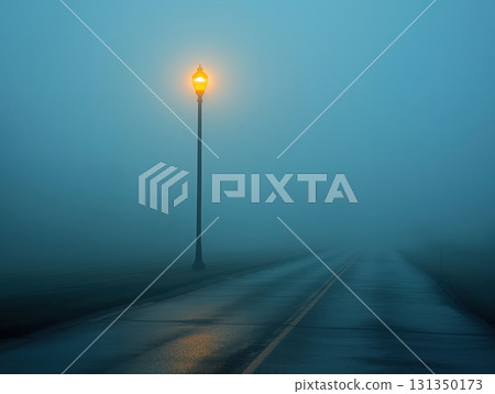 A street lamp is lit up in the fog 131350173