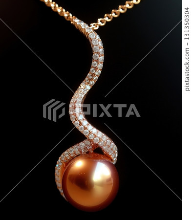 A gold and diamond necklace with a pearl pendant 131350304