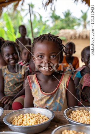 A group of children are smiling and eating food 131350425