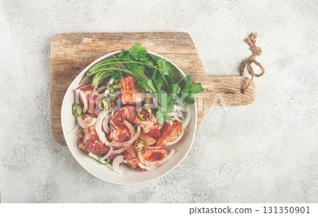 raw meat marinated with spices and onions, for barbecue, sliced meat, pork neck, in a bowl, homemade, no people, raw meat marinated with spices and onions, for barbecue, sliced meat, pork neck, in a bowl, homemade, no people, 131350901