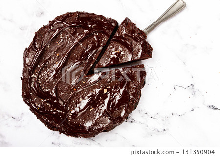 chocolate cake, round cake, on a marble light table, top view, homemade cakes, no people, chocolate cake, round cake, on a marble light table, top view, homemade cakes, no people, 131350904