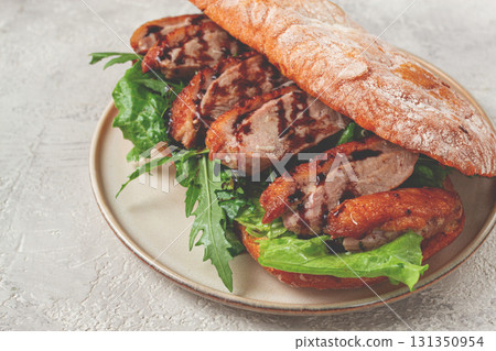 sandwich with duck breast and arugula, balsamic sauce, on a light plate, breakfast, homemade, no people, 131350954